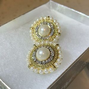 White traditional styled earrings